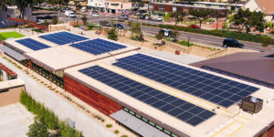 Large school building with solar panels covering roof